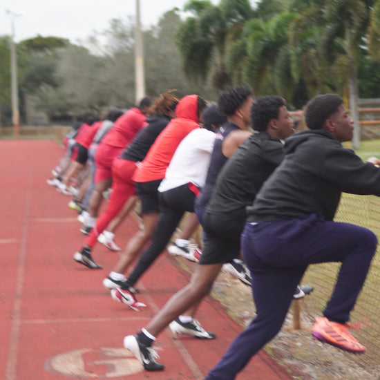 Proper sprint mechanics showing arm action and knee drive for maximum speed development