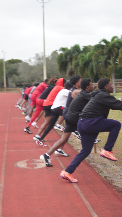 Proper sprint mechanics showing arm action and knee drive for maximum speed development