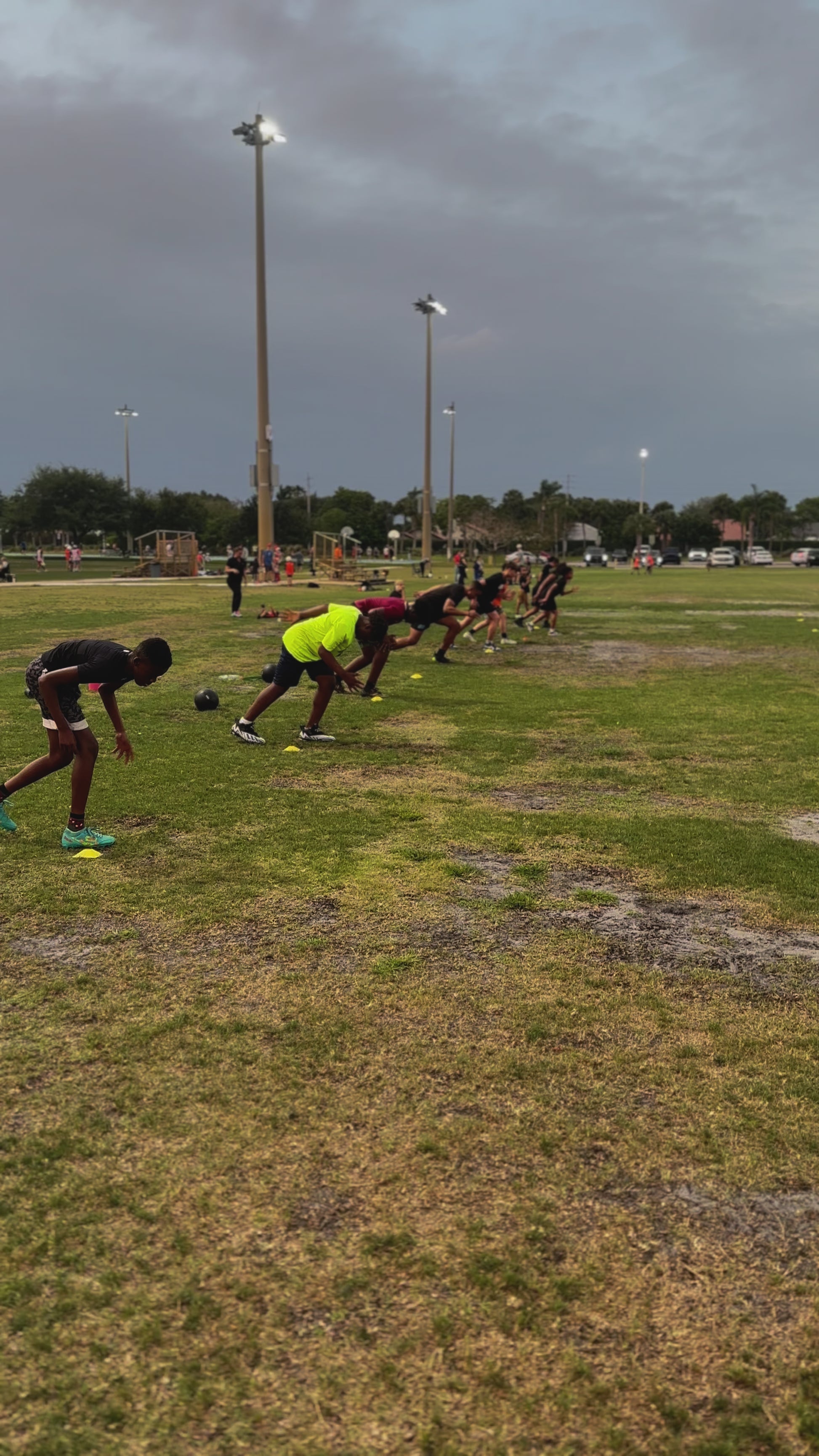 Athlete demonstrating explosive sprint start technique from standing position in Speed Kills program