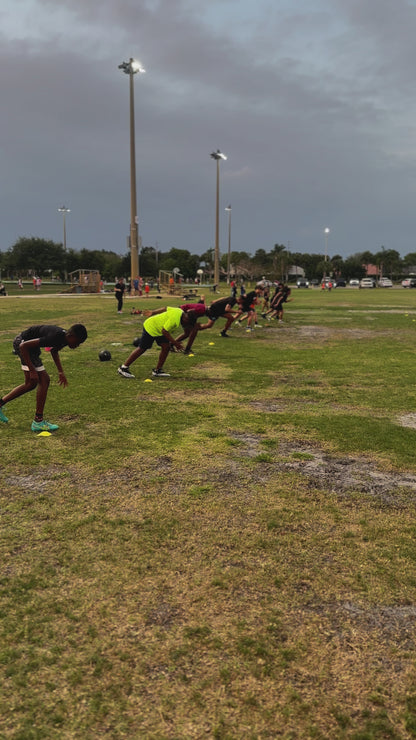 Athlete demonstrating explosive sprint start technique from standing position in Speed Kills program