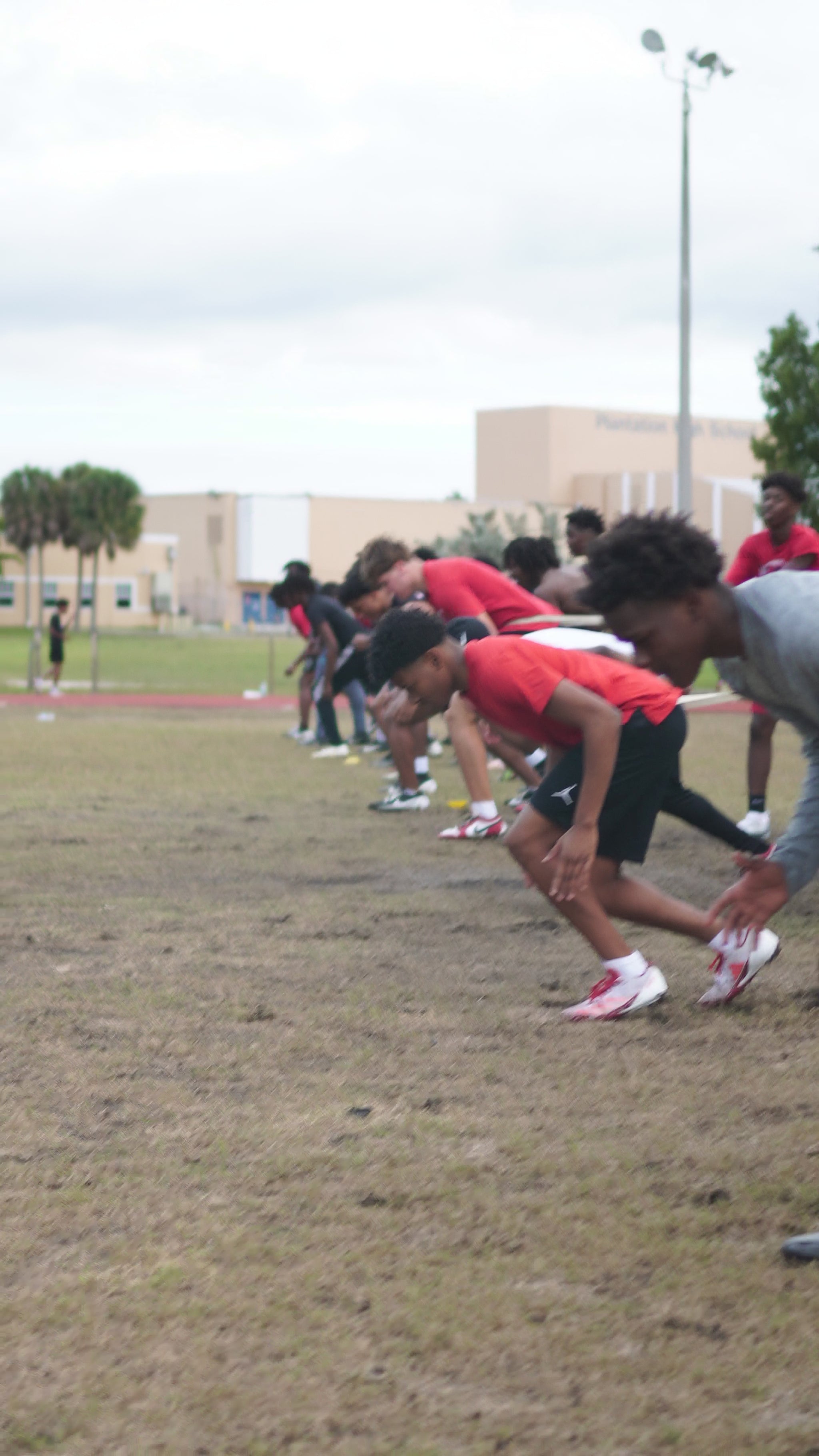 Athlete performing resisted sprint training to build power and improve sprint start explosiveness COLOR